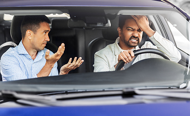 Image showing car driving instructor talking to man failed exam