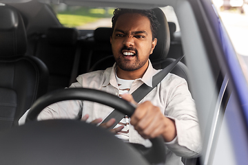 Image showing angry indian man or driver driving car