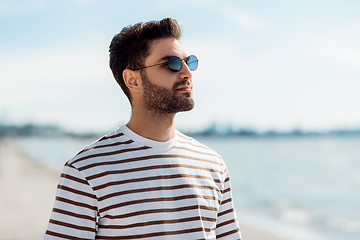 Image showing young man in sunglasses on summer beach