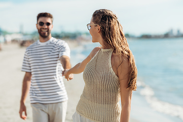 Image showing happy couple on summer beach