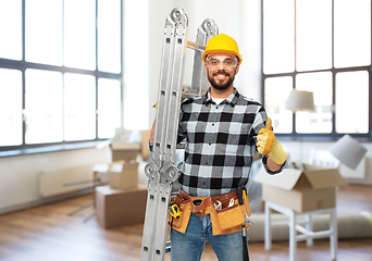 Image showing happy male builder in helmet with ladder at home