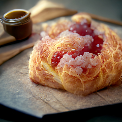 Image showing French croissant. Freshly baked croissant with jam on dark woode