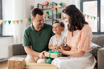 Image showing parents giving birthday present to little son