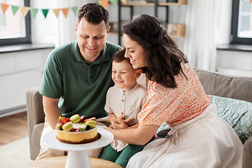 Image showing happy family with birthday cake at home