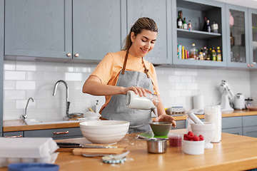 Image showing woman cooking food and baking on kitchen at home