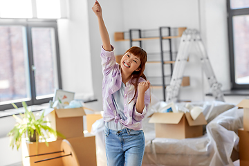 Image showing happy asian woman with stuff moving to new home