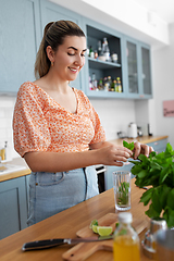 Image showing woman making cocktail drinks at home kitchen