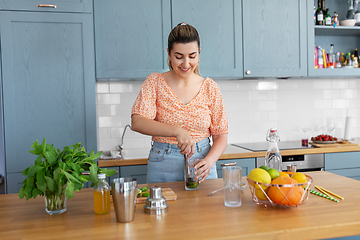 Image showing woman making cocktail drinks at home kitchen