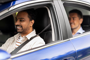 Image showing indian male driver driving car with passenger