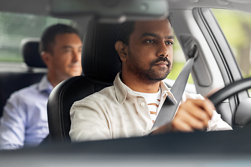 Image showing indian male driver driving car with passenger