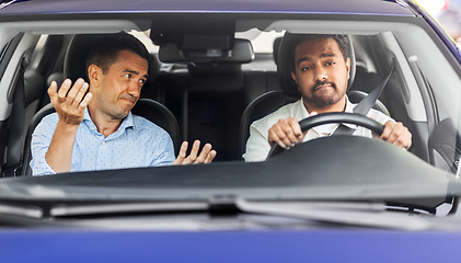 Image showing car driving instructor talking to man failed exam