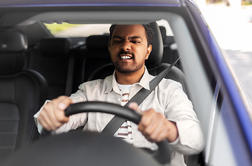 Image showing angry indian man or driver driving car