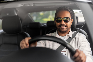 Image showing smiling indian man in sunglasses driving car