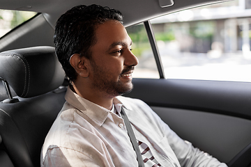 Image showing smiling indian male passenger in taxi car