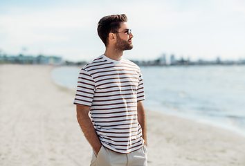 Image showing young man in sunglasses on summer beach