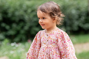 Image showing happy little baby girl outdoors in summer