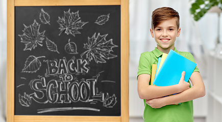 Image showing happy student boy with folders and notebooks