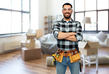 Image showing happy male repairman or builder at home