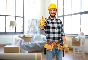 Image showing happy male builder showing thumbs up at home