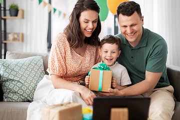 Image showing happy family with tablet pc at home on birthday