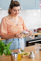 Image showing woman making cocktail drinks at home kitchen