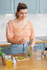 Image showing woman making cocktail drinks at home kitchen