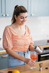 Image showing woman making cocktail drinks at home kitchen