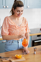 Image showing woman making cocktail drinks at home kitchen