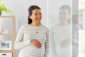 Image showing happy pregnant asian woman at home