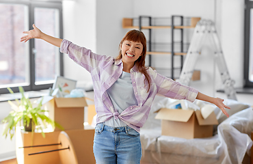 Image showing happy asian woman with stuff moving to new home