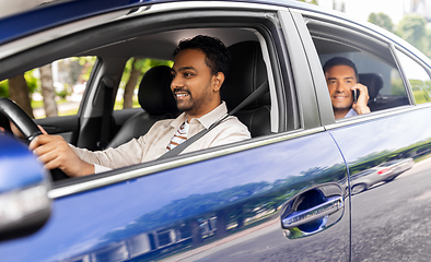 Image showing male passenger calling on smartphone in taxi car