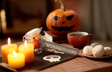 Image showing halloween party treats and decorations on table