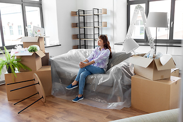 Image showing happy asian woman with stuff moving to new home