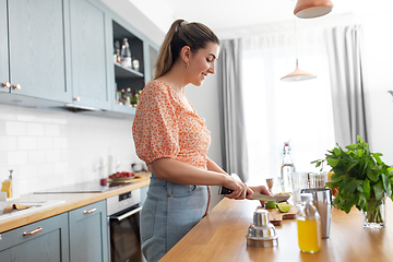 Image showing woman making cocktail drinks at home kitchen