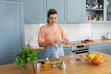 Image showing woman making cocktail drinks at home kitchen