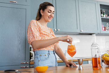 Image showing woman making cocktail drinks at home kitchen