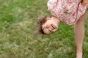 Image showing happy smiling little baby girl having fun outdoors