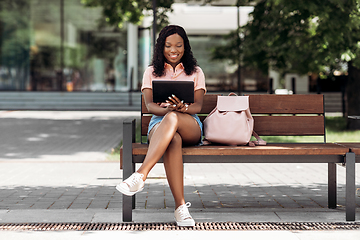 Image showing african american woman with tablet pc in city