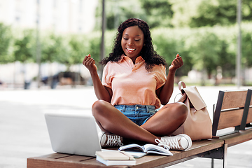 Image showing african student girl with laptop and books in city