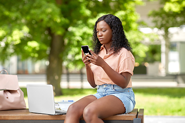 Image showing african student girl with laptop and smartphone