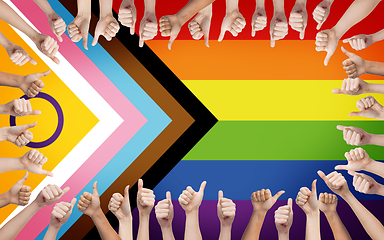 Image showing hands showing thumbs up over progress pride flag