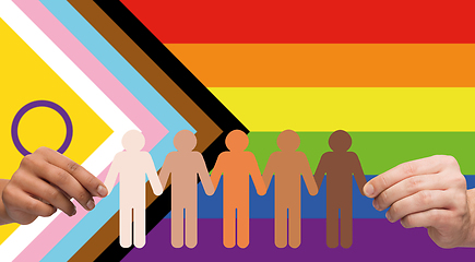 Image showing hands holding people pictogram over pride flag