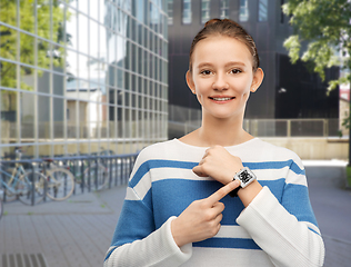 Image showing teenage girl showing smart watch with qr code