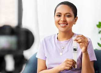 Image showing female blogger showing smart watch with qr code