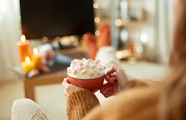 Image showing woman with cream and marshmallow on halloween