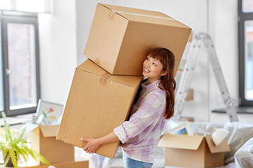 Image showing happy woman holding boxes and moving to new home