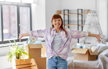 Image showing happy asian woman with stuff moving to new home