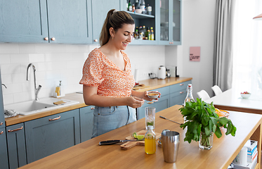 Image showing woman making cocktail drinks at home kitchen