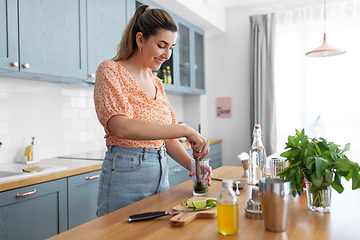 Image showing woman making cocktail drinks at home kitchen