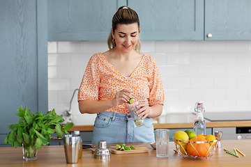 Image showing woman making cocktail drinks at home kitchen